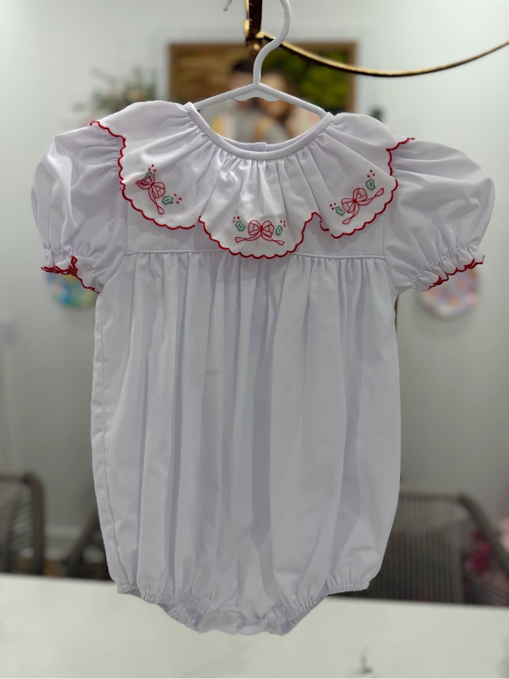 Classic White Baby One-Piece with Red Trim and Floral Embroidery